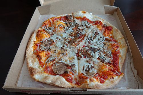 MOD crust, spicy calabrian chili red sauce, v. cheese, and fungo. at Mod Pizza - Mueller Market in Austin