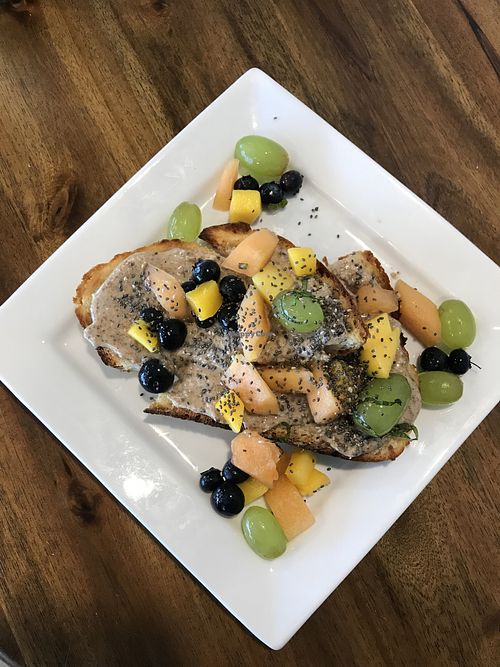 Almond butter + fruit on toast  at Green Light Coffee - S Staples St in Corpus Christi