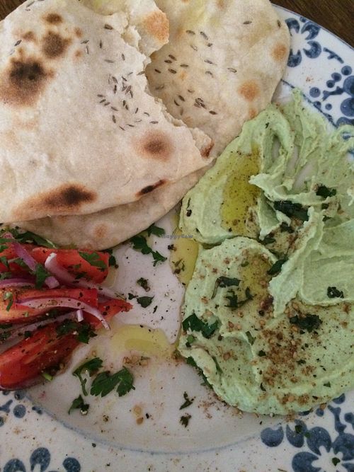 Seasonal dish: fava beans hummus with homemade bread and a salad. at Klubojadalnia Młodsza Siostra in Warsaw