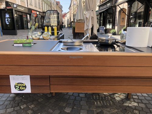 outside kitchen where dishes are prepared in front of you at Güjžina - Green One Bistro in Ljubljana