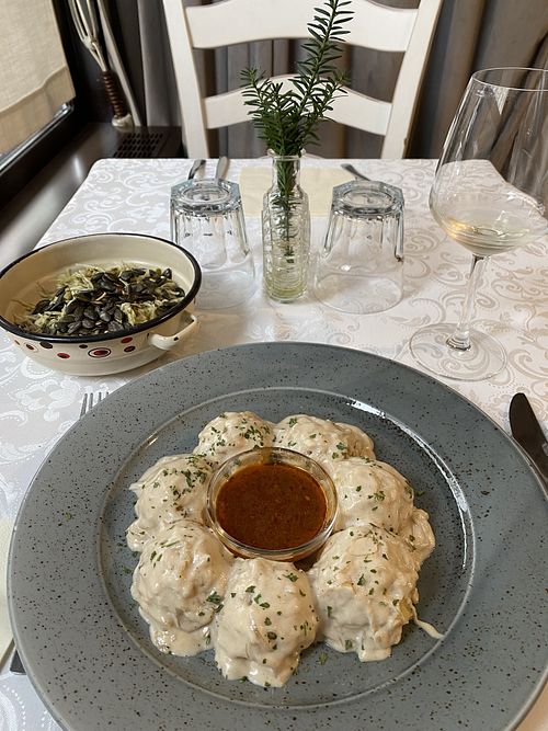 Vegan dödöles and cabbage salad with pumpkin seed oil  at Güjžina - Green One Bistro in Ljubljana