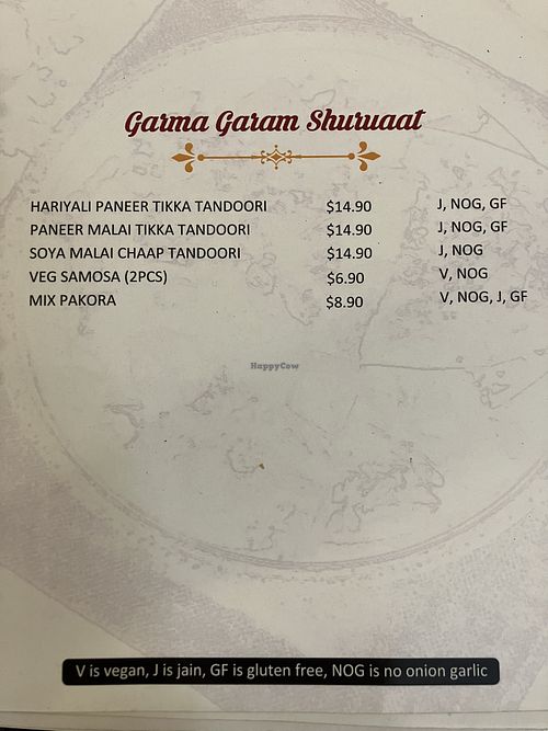 Dishes marked V are listed as vegan. I was advised by serving staff we should still specifically request vegan when ordering so kitchen staff don’t add ghee.  at Taj Indian Sweets in Harris Park
