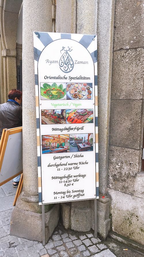 sign outside at Ayam Zaman in Linz