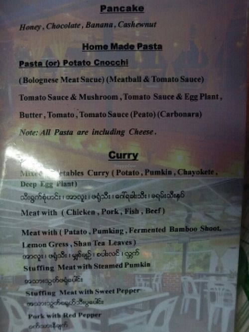 serves pancake,  curry and pasta at Home Again in Kalaw