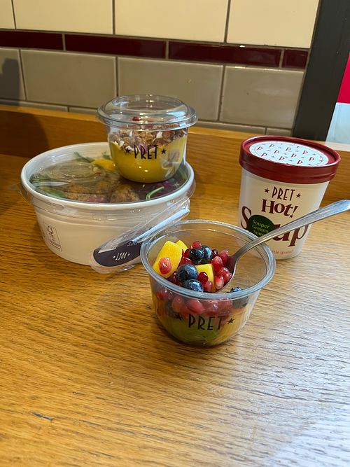 Fruit cup, soup, a grain bowl, and a little dessert bowl.  at Pret A Manger - Fitzrovia in London