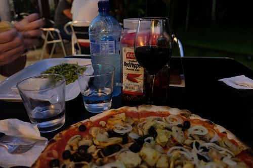 Pizza with wine at Ristorante Pizzeria Cahuita in Cahuita