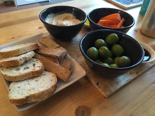 Bread and hummus and olives at CAN Waterloo in Liverpool