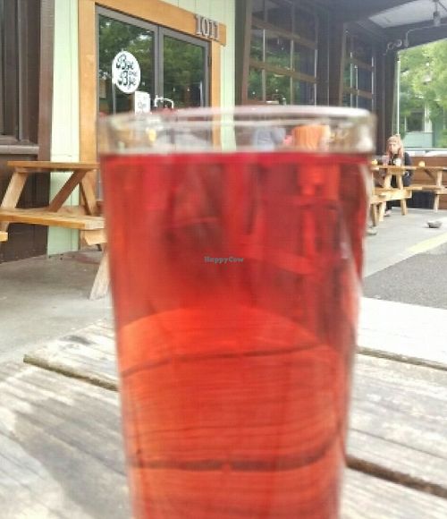 outside with a cider at The Bye and Bye in Portland