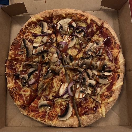Vegan pizza Margherita (extra toppings: BBG swirl, red onion and mushrooms) at Domino's Pizza in Castricum