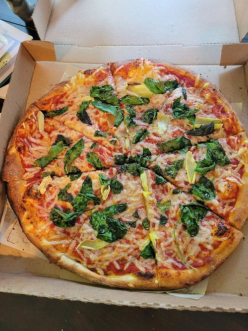 Vegan cheese pizza with spinach and artichoke at Blaze Pizza in Clark