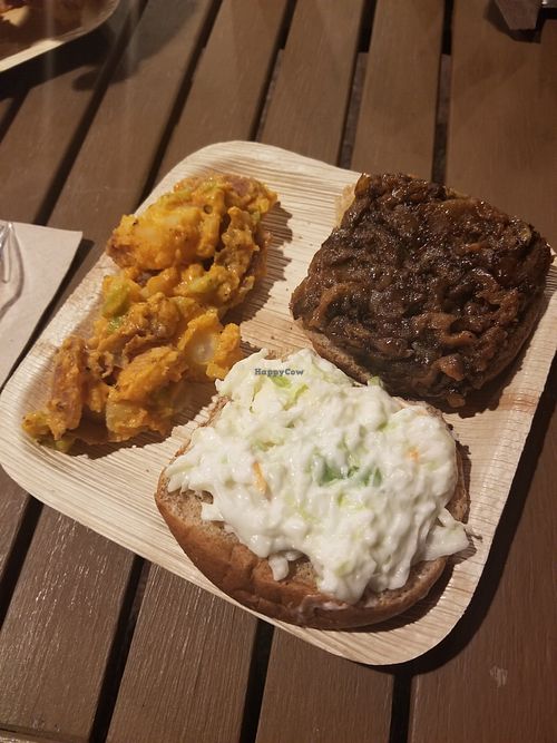 Magical bbq sandwich with slaw on top and magical potato salad! at Magic Vegan Cafe in Gulfport