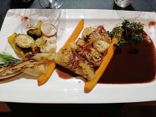 Main dish with super interesting combination of cabbage roles and a chocolate, red wine sauce at Au Goût du Jour in Eupen