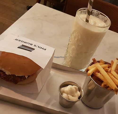 Crispy vegan seitan burger, vegan vanilla mylkshake, vegan garlic dip and fries at Phil's Burger - Gotgatan in Stockholm
