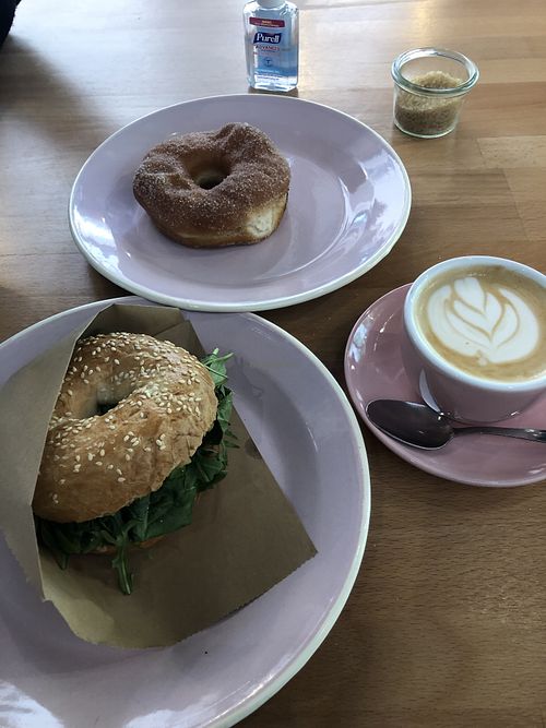 Bagel sandwich, cinnamon sugar donut and of course, cappuccino! at Brammibal's Donuts - Potsdamer Platz in Berlin