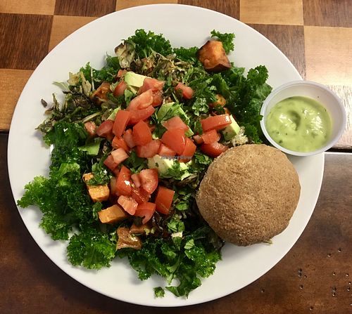 Build your own bowl with kale, brussels, mushrooms, cilantro, tomatoes, avocados, and a plain roll. at Sweet Elizabeth's Organics Bakery in Colorado Springs