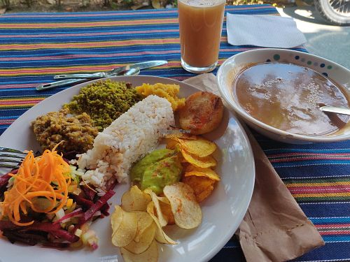 Dish of the day with bean soup and tamarind juice. at Alma Natura in Medellin