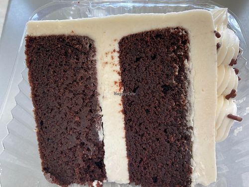 So simple and so good! Gf chocolate cake with vanilla icing! at Vegan East in Minneapolis