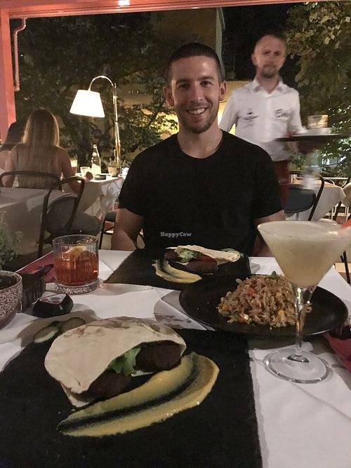 Our vegan burgers which came in pita bread, and a vegan risotto as a side. at Çoko in Tirana