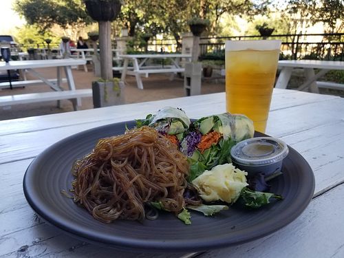 Avocado roll, tahini dressing, sweet potato noodles on the beautiful patio. at Nancy's Sky Garden in Austin