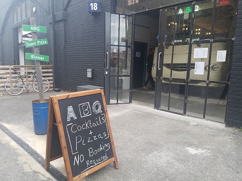 Outside signage at Saint Pizza in East London