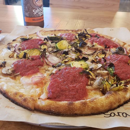 veggie pizza with vegan cheese at Blaze Pizza in Melbourne