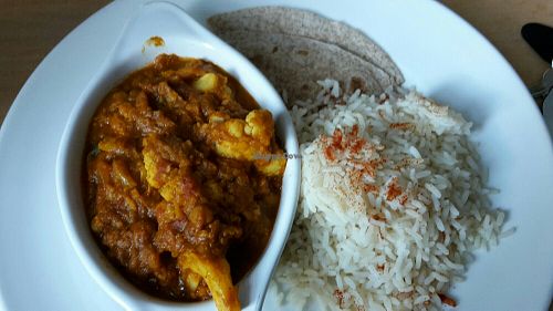 Vegan cauliflower curry with bread and rice at McInnes House Hotel in Kingussie