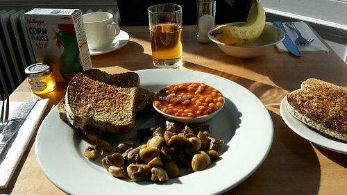 Vegan breakfast: baked beans, mushrooms, cereals, juice, fresh fruit, soya milk, etc at McInnes House Hotel in Kingussie