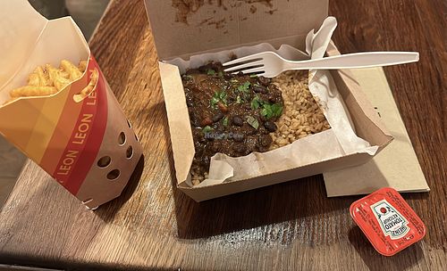 Black bean rice box and waffle fries   at LEON - Shaftesbury Avenue in London