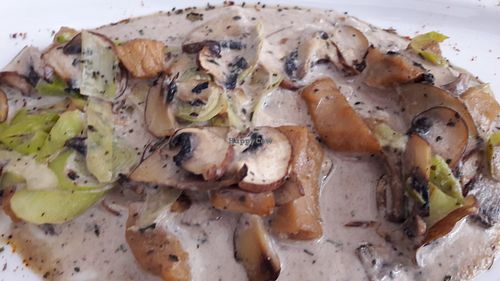 mushrooms with garlic shoots and heura (vegan protein) at Restaurante Vegano Tierra Madre in Valencia