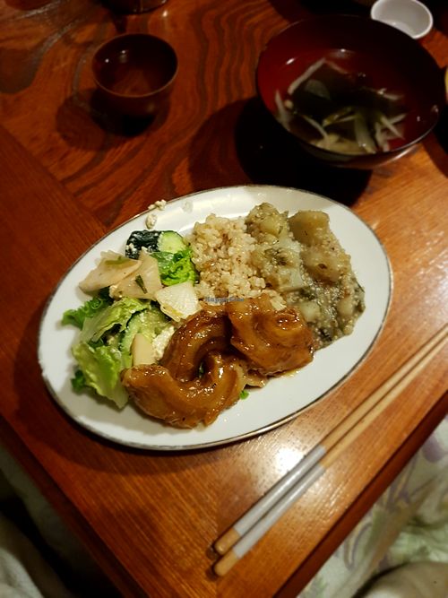 Dinner plate - organic millet and potato, organic brown rice, kuruma fu (gluten meat), fried green vegies. at Dana Village in Nishiaizu