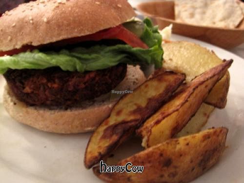 Burger Aux Vivres

Pretty good, but not my favorite. The wedges are not bad. The coleslaw (in the back) is great. at Aux Vivres - St Laurent in Montreal