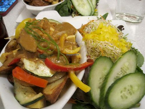 Royal Poutine... it's not on the menu very often, but don't picture a greasy poutine, it's more like veggies on big oven fries with gravy. It's still delicious. at Aux Vivres - St Laurent in Montreal