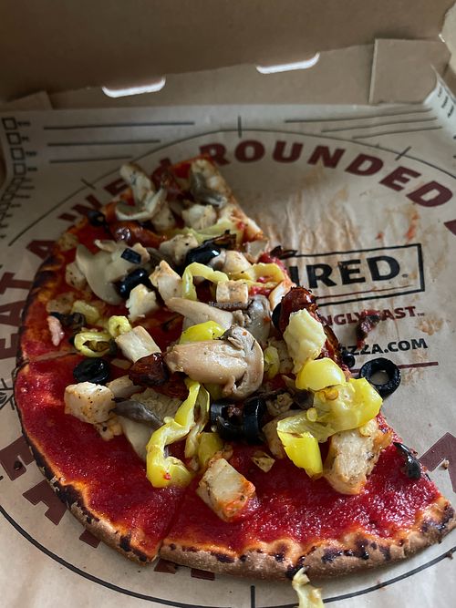 GF crust, sweet red sauce, grilled chicken, banana peppers, black olives, cooked mushrooms, roasted tomatoes at Rapid Fired Pizza in Sandusky