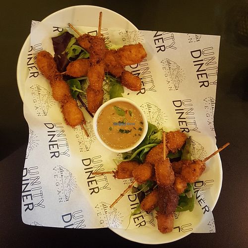Satay chick'n skewers at Unity Diner in East London