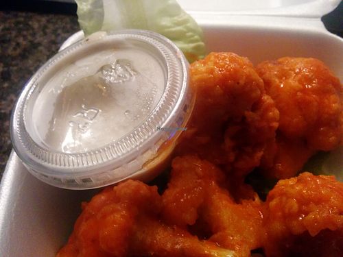 Tasty cauliflower nuggets; these are buffalo sauced. Also available with BBQ or lemon pepper sauces. Again, good hot and cold; takeout for an evening outdoor concert. at Lindiana's Southern Vegan Kitchen - Maybe closed in Houston