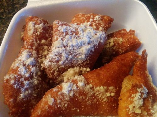 Vegan beignets! Yes, the Creole/Cajun delicacy deliciously veganized, light fluffy inside, crispy outside, with the obligatory sprinkling of powdered sugar. Good hot and room temperature, for breakfast the next day while flying. at Lindiana's Southern Vegan Kitchen - Maybe closed in Houston