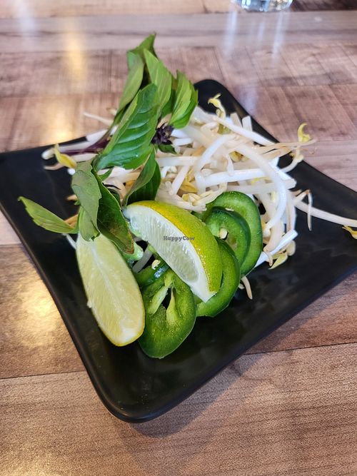 Bean sprouts, jalapeños, Thai basil, and limes for the pho at Pho Van in Pittsburgh