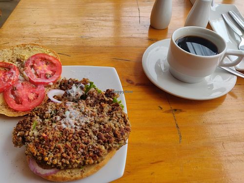 Lentil burger and americano. S.25 and S.4. at Angela's Place in Mancora