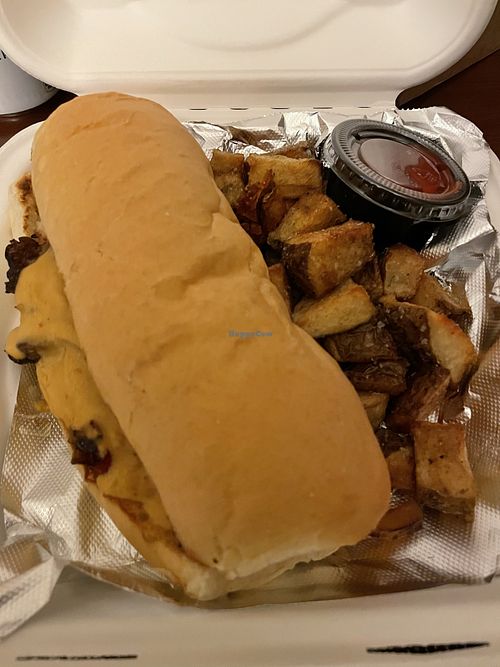 Mushroom philly take out with home fries at Irregardless Cafe in Raleigh