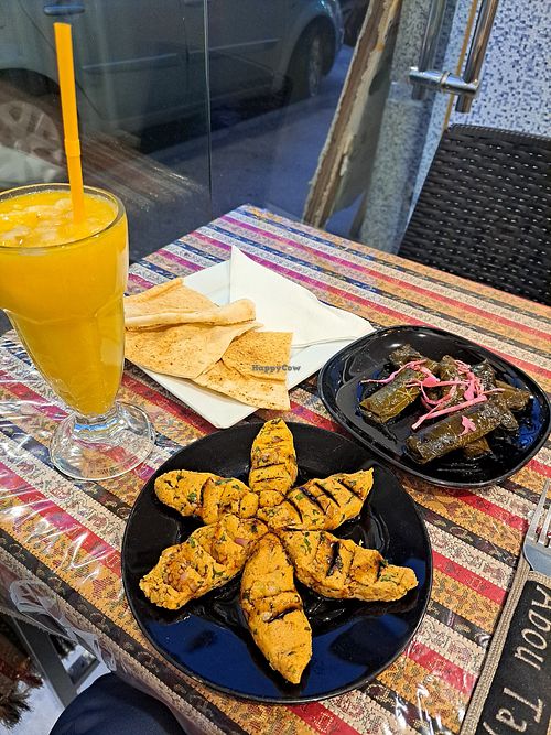 Mango juice, kibbeh, stuffed vine leaves, flat bread at Abou Tayssir in Tangier