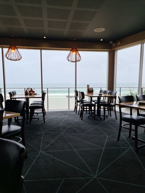 From the inside,  pleasant seating with view at Coolum Surf Club in Coolum Beach