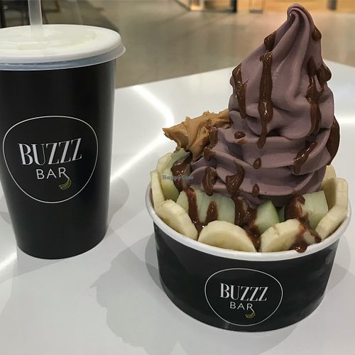 Acai Buzzz Bowl with Choc Sauce + Freshly squeezed Juice at Buzzz Bar in Sylvania