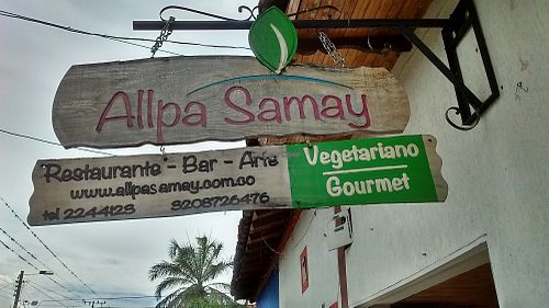 Outdoor sign at Allpa Samay in Tulua