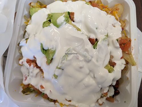 Vegan loaded fries. Surcharge for vegan sour cream, vegan cheese & extra roasted veggies at Ole Ole Burrito Express in Oakland