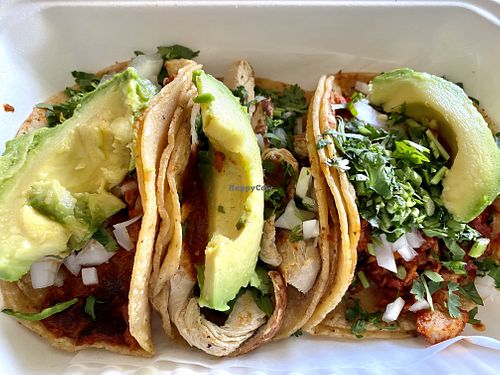 Three tacos side by side. Soyrizo, chik’n, and seitan, (top to bottom).  All come with avocado and side salsas.  So good! at Ole Ole Burrito Express in Oakland