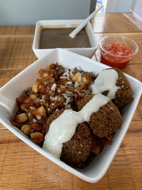 Falafel bowl and mushroom soup. Harissa on the side.  at Koshary Corner in Clarksville