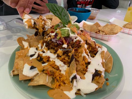 Huge nachos. Lots of toppings but no cheese. Would add cheese next time. at Belenty's Love in Granbury