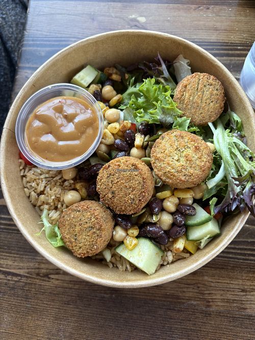 Create your own bowl with Falafel and evil peanut on the side  at The Chopped Leaf in Brandon