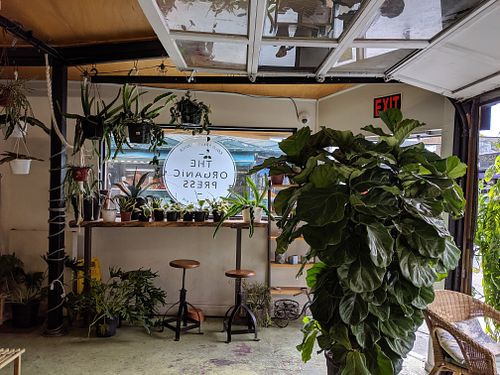 Interior - entrance and seating at The Organic Press in Toronto