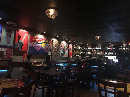 Seating area and art at Lokos Takos Taqueria in Fort Lauderdale